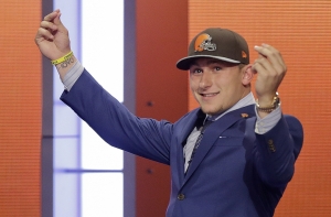 FILE - In this May 8, 2014, file photo, Texas A&M quarterback Johnny Manziel reacts after being selected by the Cleveland Browns as the 22nd pick during the first round of the NFL Draft in New York. The Browns indicated Tuesday, Feb. 2, 2016, that theyve finally had enough of Manziels bad-boy behavior and intend to release the quarterback in March when the league begins its next calendar year. (AP Photo/Frank Franklin II, File)