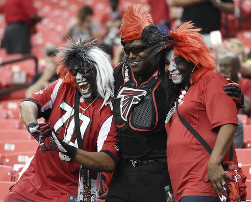 Atlanta Falcons fans cheer as teams warm up before the first of an NFL football game between the Atlanta Falcons and the Green Bay Packers, Sunday, Oct. 30, 2016, in Atlanta. (AP Photo/Rainier Ehrhardt)