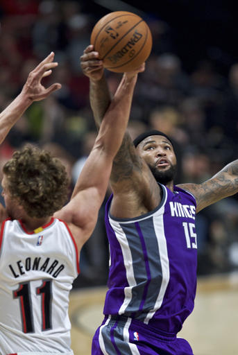 Sacramento Kings center DeMarcus Cousins, right, and Portland Trail Blazers forward Meyers Leonard vie for a rebound during the second half of an NBA basketball game in Portland, Ore., Friday, Nov. 11, 2016. (AP Photo/Craig Mitchelldyer)