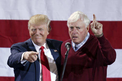 Former basketball coach Bobby Knight, right, appears onstage with Republican presidential candidate Donald Trump during a campaign rally in Grand Rapids, Mich., Monday, Oct. 31, 2016. (AP Photo/Nati Harnik)