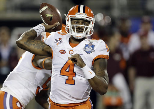 FILE - In a Saturday, Dec. 3, 2016 file photo, Clemson quarterback Deshaun Watson (4) looks to pass during the first half of the Atlantic Coast Conference championship NCAA college football gam against Virginia Tech, in Orlando, Fla. Watson acknowledges things have not been as free and easy at returning to the Heisman Trophy stage as it was getting there a year ago, when he finished third in the balloting. (AP Photo/Chris O'Meara, File)