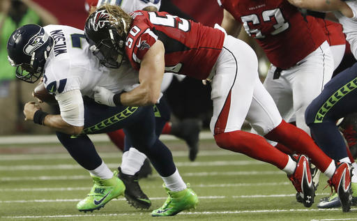 Atlanta Falcons defensive end Brooks Reed (50) sacks Seattle Seahawks quarterback Russell Wilson (3) during the first half of an NFL football NFC divisional playoff game, Saturday, Jan. 14, 2017, in Atlanta. (AP Photo/John Bazemore)