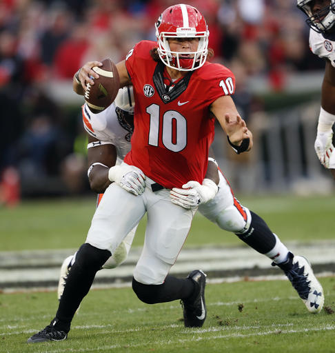 Georgia quarterback Jacob Eason (10) is brought down by Auburn defensive tackle Montravius Adams (1) during the first half of an NCAA college football game Saturday, Nov. 12, 2016, in Athens, Ga. (AP Photo/John Bazemore)