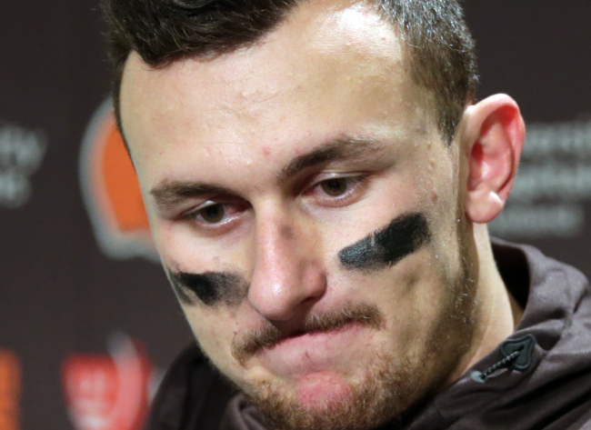 FILE - In this Dec. 20, 2015, file photo, Cleveland Browns quarterback Johnny Manziel speaks with media members following the team's 30-13 loss to the Seattle Seahawks in an NFL football game in Seattle. Former Cleveland Browns quarterback Johnny Manziel was indicted by a grand jury on Tuesday, April 26, 2016, on misdemeanor charges stemming from a domestic violence complaint by his ex-girlfriend. (AP Photo/Scott Eklund, File)