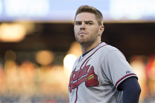 FILE - In tis July 31, 2015, file photo, Atlanta Braves' Freddie Freeman looks on during the first inning of a baseball game against the Philadelphia Phillies in Philadelphia. Freeman was placed on the 15-day disabled list Tuesday, Aug. 4, 2015, with an oblique injury. Freeman was injured fouling off a ball Monday, Aug. 3, against the San Francisco Giants and was removed from the game. (AP Photo/Chris Szagola, File)