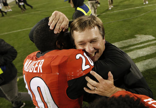 Georgia head coach Kirby Smart celebrates with safety Quincy Mauger (20) after defeating Auburn 13-7 in an NCAA college football game Saturday, Nov. 12, 2016, in Athens, Ga. (AP Photo/John Bazemore)