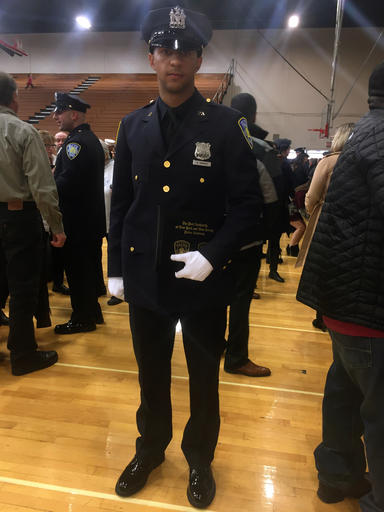 In this photo provided by The Port Authority of New York & New Jersey, Anthony Varvaro, who graduated from the Port Authority of New York and New Jersey police academy poses at a graduation ceremony in Elizabeth, N.J., Friday, Dec. 9, 2016. Varvaro was a relief pitcher for the Atlanta Braves, Seattle Mariners and Boston Red Sox from 2010 to 2015. (Joseph Pentangelo/The Port Authority of New York & New Jersey via AP)