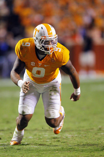FILE - In this Sept. 12, 2015, file photo, Tennessee defensive end Derek Barnett rushes during double overtime of an NCAA college football game against Oklahoma in Knoxville, Tenn. The matchup Saturday, Oct. 8, 2016, between No. 8 Texas A&M and No. 9 Tennessee potentially features two of the naton's top pass rushers in the Aggies' Myles Garrett and Barnett, assuming Garrett is healthy enough to play after sitting out last week's victory over South Carolina. (AP Photo/Wade Payne, File)