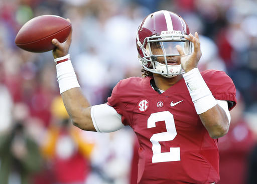 Alabama quarterback Jalen Hurts sets back to pass the ball during the first half of the Iron Bowl NCAA college football game, Saturday, Nov. 26, 2016, in Tuscaloosa, Ala. (AP Photo/Brynn Anderson)
